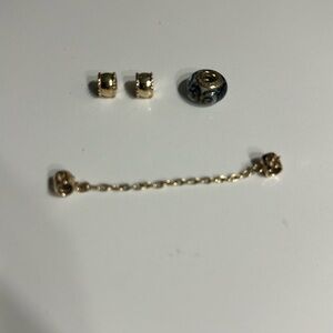 Pandora 2 clips the safety chain and the charm has glass and blue design Gold